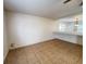 Open-concept living area featuring tile floors, connecting to a kitchen area at 1325 Bella Coola Dr, Orlando, FL 32828