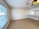 Bright living room featuring a modern ceiling fan, and passthrough to another living space at 1325 Bella Coola Dr, Orlando, FL 32828