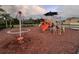 A colorful community playground with slides, climbing structures, and picnic area under shaded canopies at 1325 Bella Coola Dr, Orlando, FL 32828