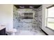 Bathroom with marble tile and walk-in shower at 13851 Rushing Creek Run, Orlando, FL 32824
