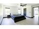 Bright bedroom featuring black trim and minimalist furniture at 13851 Rushing Creek Run, Orlando, FL 32824
