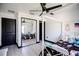 Bright bedroom featuring ample closet space, a decorative ceiling fan, and modern stylish decor at 13851 Rushing Creek Run, Orlando, FL 32824