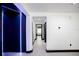 Hallway with decorative accent wall and white walls at 13851 Rushing Creek Run, Orlando, FL 32824