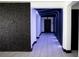 Contemporary hallway showcases textured accent walls and LED lighting at 13851 Rushing Creek Run, Orlando, FL 32824