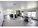 Open-concept living and dining area featuring tile flooring, recessed lighting, and an entertainment center at 13851 Rushing Creek Run, Orlando, FL 32824
