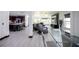 Open-concept home with modern furniture, a sleek kitchen island, and a luxurious massage chair at 13851 Rushing Creek Run, Orlando, FL 32824