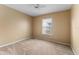 Bright bedroom featuring neutral carpet, paint, ceiling fan and window at 14780 Hartford Run Dr, Orlando, FL 32828