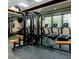 Modern gym featuring treadmills, weight machines, and expansive windows with beautiful views at 14780 Hartford Run Dr, Orlando, FL 32828
