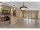 Open kitchen area boasts oak cabinets, stainless steel appliances, and adjacent dining area at 14780 Hartford Run Dr, Orlando, FL 32828