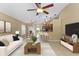 Cozy living room with a view of the kitchen and dining area; tastefully decorated with modern furnishings at 14780 Hartford Run Dr, Orlando, FL 32828