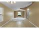 Open floor plan with vaulted ceilings, large windows, and neutral color palette at 14780 Hartford Run Dr, Orlando, FL 32828