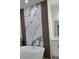 Elegant bathroom with a freestanding tub, decorative wall accents, and a sleek vanity with modern fixtures at 16494 Sw 54Th Court Rd, Ocala, FL 34473