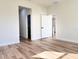 Hallway with wood-look flooring, trim and doorways at 16494 Sw 54Th Court Rd, Ocala, FL 34473