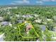 Aerial view showing this house located in a quiet neighborhood with mature trees and green spaces at 1905 Old Club Pt, Maitland, FL 32751