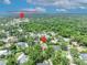 An aerial view highlights the location in a lush, established neighborhood near local schools at 1905 Old Club Pt, Maitland, FL 32751