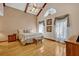Cozy bedroom featuring vaulted ceilings, ample natural light, and neutral decor for a peaceful retreat at 1905 Old Club Pt, Maitland, FL 32751