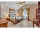 Comfortable bedroom with vaulted ceiling and decorative windows, offering a serene retreat at 1905 Old Club Pt, Maitland, FL 32751