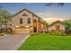 Inviting home with manicured lawn, water feature, and warm lighting at sunset at 1905 Old Club Pt, Maitland, FL 32751