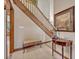 Entryway featuring tiled floors, staircase, and decorative accents at 1905 Old Club Pt, Maitland, FL 32751