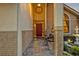 Inviting front porch with tile flooring, seating, and decorative planters at 1905 Old Club Pt, Maitland, FL 32751