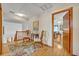 Charming hallway featuring hardwood floors, a decorative rug, and views into other living spaces at 1905 Old Club Pt, Maitland, FL 32751