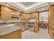 Well-equipped kitchen with granite countertops, stainless steel appliances, and wood cabinetry at 1905 Old Club Pt, Maitland, FL 32751