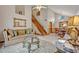 Open-concept living room and dining area with high ceilings and staircase at 1905 Old Club Pt, Maitland, FL 32751