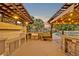 Outdoor kitchen with built in grill and bar, illuminated with string lights at 1905 Old Club Pt, Maitland, FL 32751