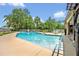 Sparkling swimming pool surrounded by lush landscaping and a spacious deck at 1905 Old Club Pt, Maitland, FL 32751