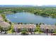 Aerial view of complex showcasing the building's proximity to the serene lake at 1979 Summer Club Dr # 111, Oviedo, FL 32765