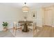 Cozy dining room with stylish lighting and comfortable seating at 1979 Summer Club Dr # 111, Oviedo, FL 32765