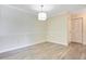The dining area features modern lighting and wood-look flooring, providing a cozy ambiance at 1979 Summer Club Dr # 111, Oviedo, FL 32765