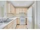 Functional kitchen with white appliances and ample counter space at 1979 Summer Club Dr # 111, Oviedo, FL 32765
