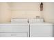 Functional laundry area with a modern washer and dryer set for convenient chore management at 1979 Summer Club Dr # 111, Oviedo, FL 32765