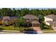 Inviting two-story home with mature trees, lovely yard, and convenient two car garage at 206 Yellow Snapdragon Dr, Davenport, FL 33837
