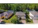 A beautiful aerial view of a two-story home, highlighting the home's backyard and community pools at 206 Yellow Snapdragon Dr, Davenport, FL 33837