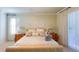 This bedroom features soft, neutral colors, a ceiling fan, and carpeted floors at 206 Yellow Snapdragon Dr, Davenport, FL 33837