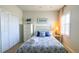 Charming bedroom with a beach theme, including nautical decor and blue accents, creating a relaxing space at 206 Yellow Snapdragon Dr, Davenport, FL 33837