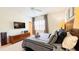 Relaxing Primary bedroom with a soft carpet, shutters, and a TV at 206 Yellow Snapdragon Dr, Davenport, FL 33837