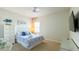 Cozy bedroom with a ceiling fan, nautical artwork, and a comfortable bed at 206 Yellow Snapdragon Dr, Davenport, FL 33837