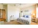 Inviting bedroom with a beach theme, closet, nautical decor, and soft lighting creating a cozy space at 206 Yellow Snapdragon Dr, Davenport, FL 33837