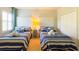 Comfortable bedroom features twin beds, closet, and nautical decor at 206 Yellow Snapdragon Dr, Davenport, FL 33837