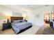 Comfortable bedroom with a ceiling fan, nautical decor, and neutral colored walls at 206 Yellow Snapdragon Dr, Davenport, FL 33837