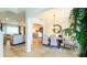 Elegant dining room with neutral tones and a view to the formal living room at 206 Yellow Snapdragon Dr, Davenport, FL 33837