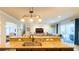 Spacious kitchen featuring dark wood cabinets, stainless steel appliances, and granite countertops at 206 Yellow Snapdragon Dr, Davenport, FL 33837