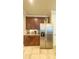 Kitchen featuring stainless steel appliances, dark wood cabinetry and granite countertops at 206 Yellow Snapdragon Dr, Davenport, FL 33837