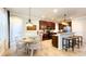 Well-lit kitchen with granite countertops, stainless steel appliances, and a cozy breakfast bar at 206 Yellow Snapdragon Dr, Davenport, FL 33837