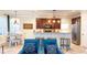 An open kitchen with modern appliances, bar seating, and views of the living room at 206 Yellow Snapdragon Dr, Davenport, FL 33837