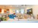 Bright and airy living room featuring tile floors, comfortable seating, and a view into other rooms at 206 Yellow Snapdragon Dr, Davenport, FL 33837
