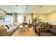 Cozy living room with comfortable seating, ceiling fan, and neutral decor at 206 Yellow Snapdragon Dr, Davenport, FL 33837
